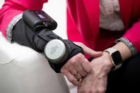 GyroGlove™ wrist brace on woman's right arm